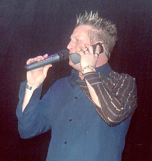 Gary singing into a cell phone!